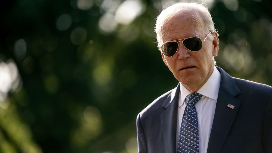 US President Joe Biden walks across the South Lawn while returning to the White House from Delaware on September 2, 2024, in Washington, DC. 